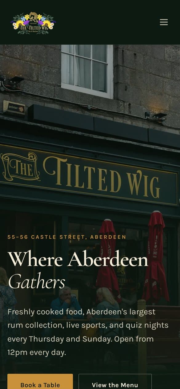 The Tilted Wig website on a phone
